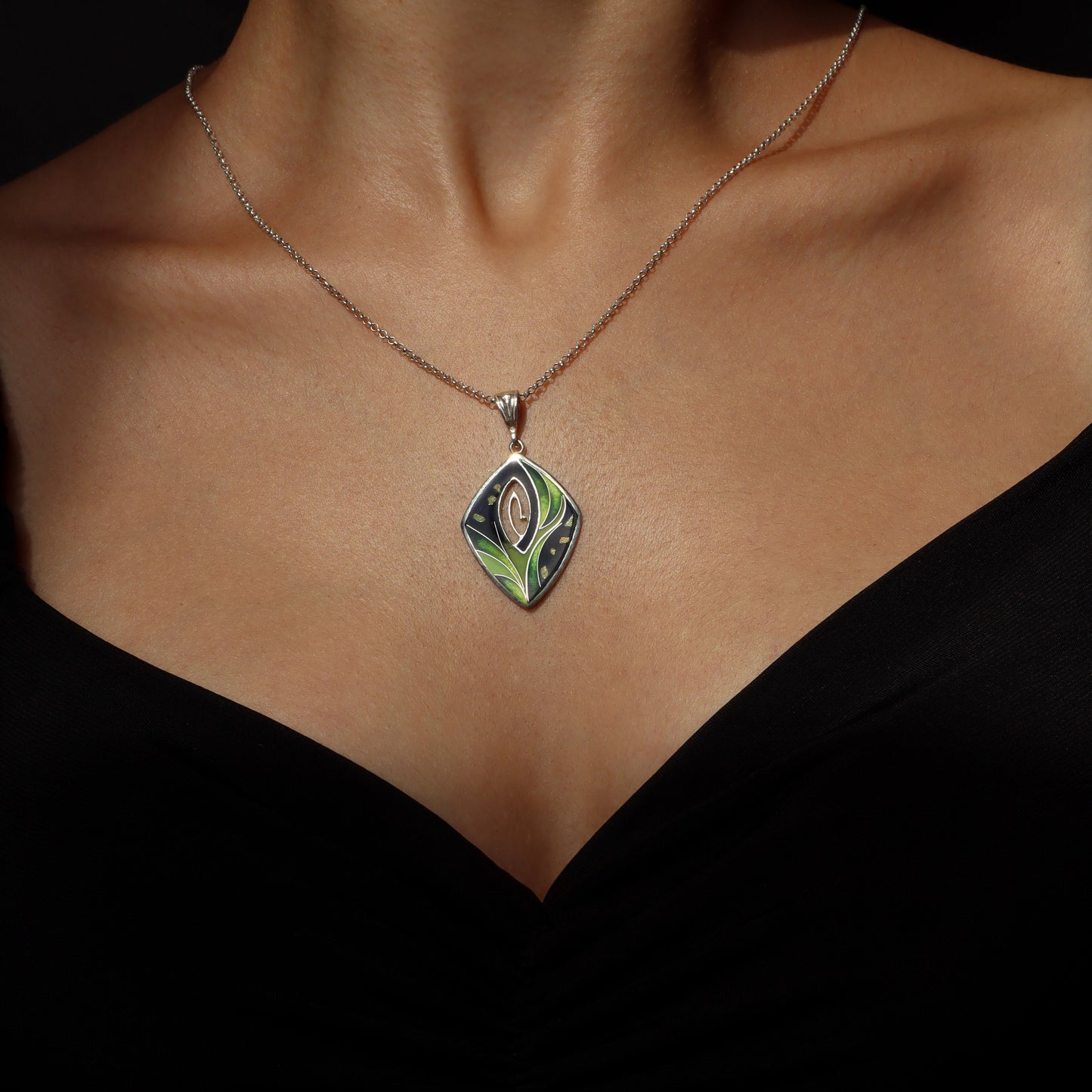 green enamel pendant with gold foil details